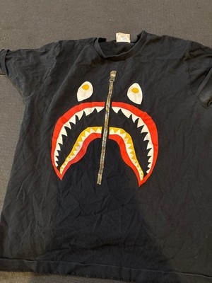 bape tee medium with shark face and authentic tag in the tee shirt and the side.