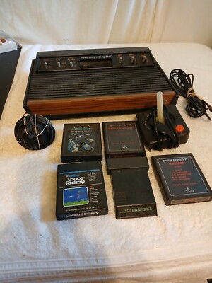 atari video computer system .NOT TESTED COMES 5  GAMES Baseball ,asteroids,Comba