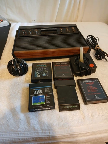 atari video computer system .NOT TESTED COMES 5  GAMES Baseball ,asteroids,Comba