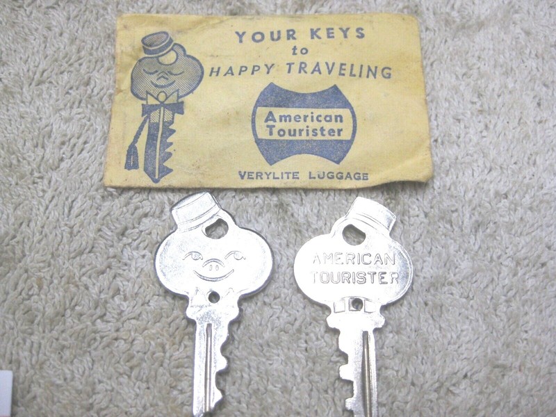 Vintage American Tourister smiling bell hop luggage keys