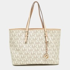 Borsa da viaggio Michael Kors Jet Set piccola in tela e pelle rivestita beige