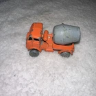 Matchbox Lesney 26a ERF cement mixer with an orange body and grey metal wheels.