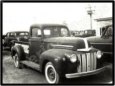 Ford Trucks New Metal Sign: Vintage Ford Pickup Truck on Used Car Sales Lot