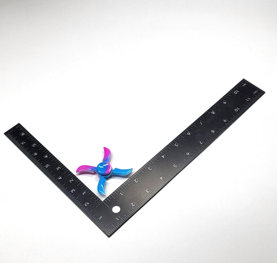 Juguete sensorial inquieto hilandero de mano con estrella de metal azul rosa alivio del estrés Foto 3 de 3