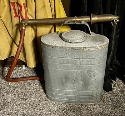 Vintage Indian back pump with brass trombone