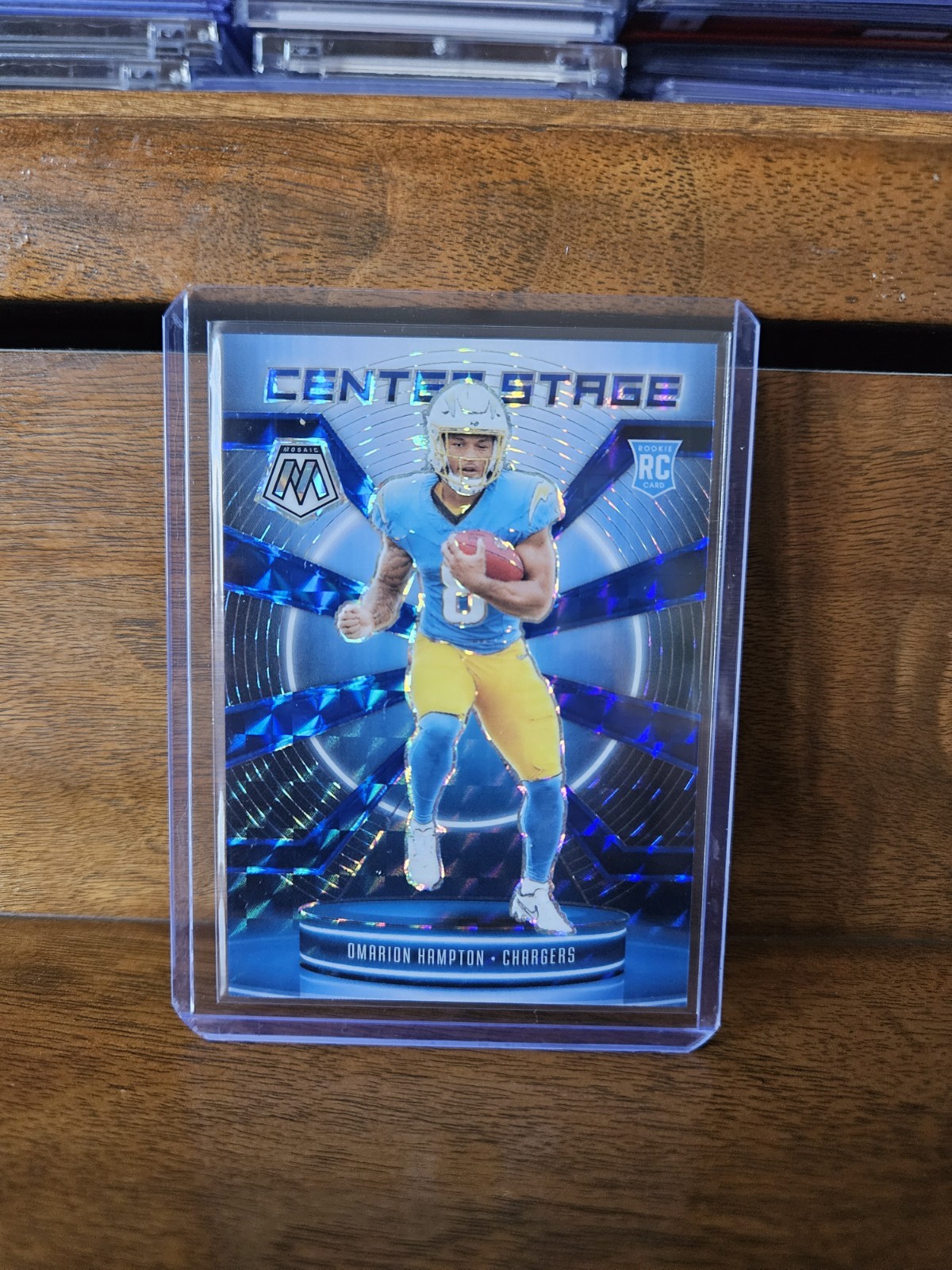 2025 Mosaic Omarion Hampton Center Stage Blue Prizm Rookie Card /99