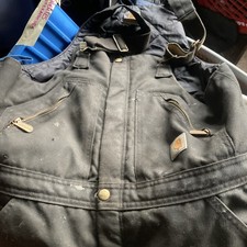 Vintage Carhartt Double-Knee Duck Canvas Bib Overalls In A Distressed Black