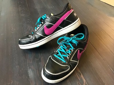 black nikes with teal swoosh