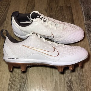 gold and white softball cleats