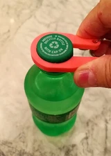 Six Water / Soda Bottle cap easy opener keychains.  Opens Tight bottle caps.
