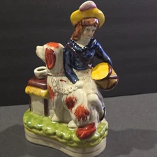 Vtg Figurine, Woman Holding drum. Sitting On Wall / Dog Victorian 9 1/2" by 6"