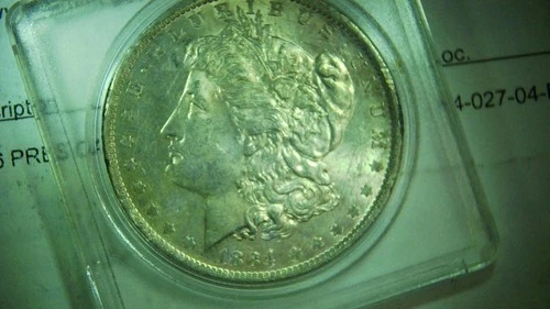 1884-O   Morgan Silver Dollar Uncirculated  w/ Bag Scratches in Plastic Holder