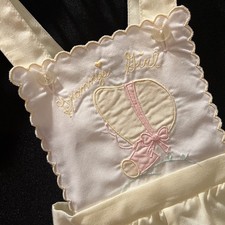Vintage yellow baby romper, 1970s, with embroidered detail