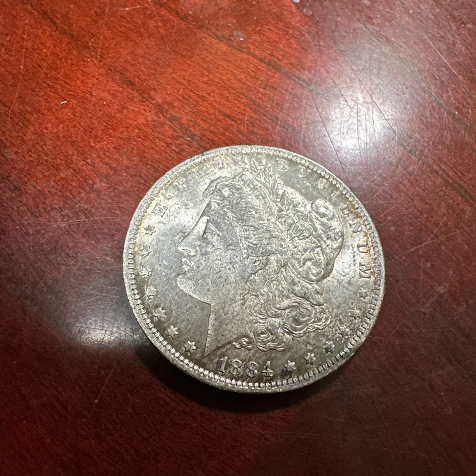 Dólar de plata Morgan 1884 en buen estado circulado. Nueva Orleans como nuevo Foto 2 de 4