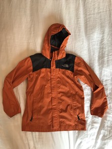 orange north face rain jacket