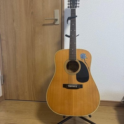 Morris acoustic guitar with capo and guitar stand