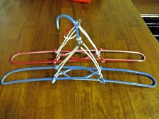 2 Vintage Collapsible Plastic Covered Wire Travel Clothes Hangers - Red - Blue