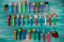28 Vintage Collectible Candy Pez Dispensers with Feet