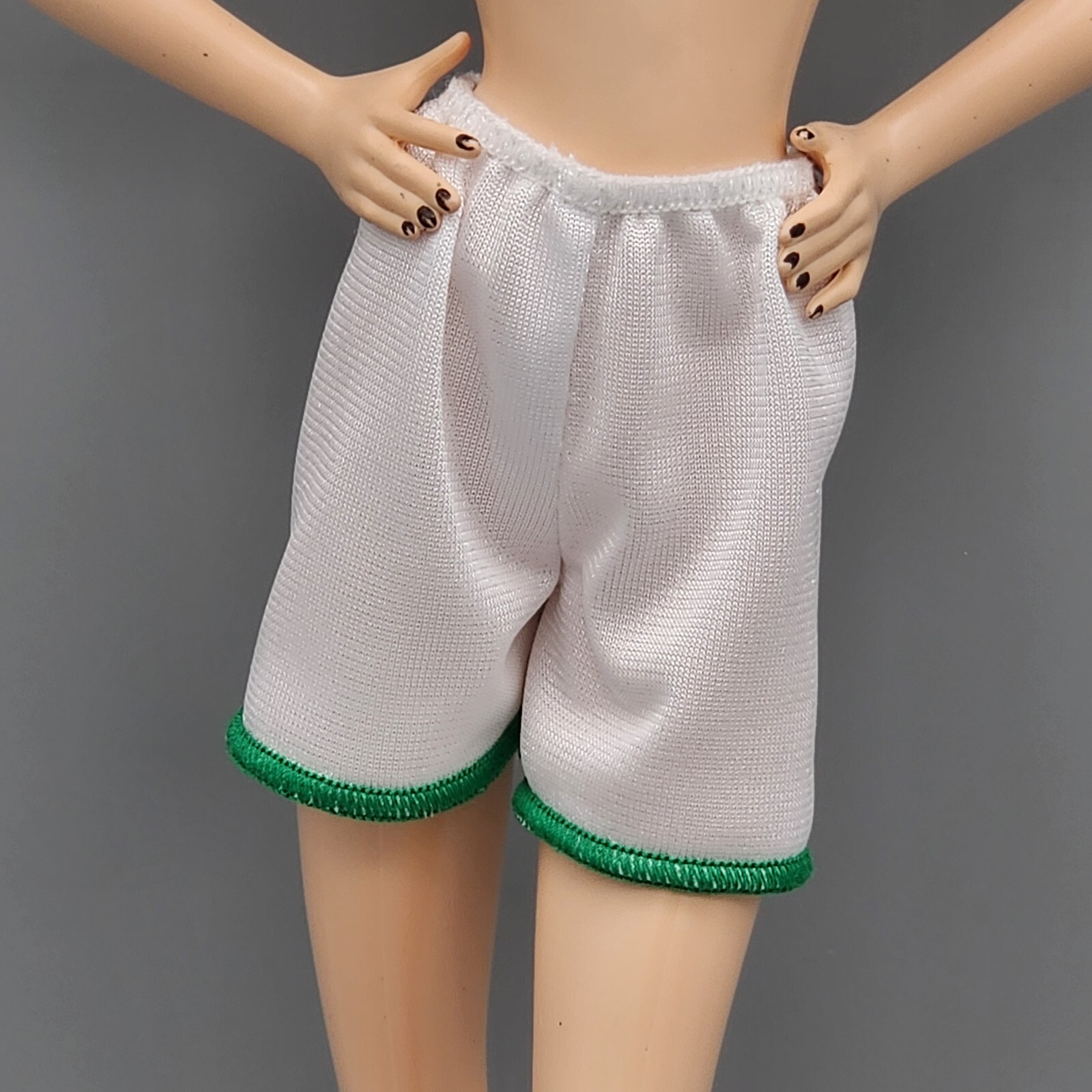 Barbie You Can Be Anything white soccer shorts with green trim doll clothes-image