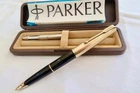 PARKER 65 FOUNTAIN PEN,BLACK WITH ROLLED GOLD CAP FULLY SERVICED WITH CASE INST.