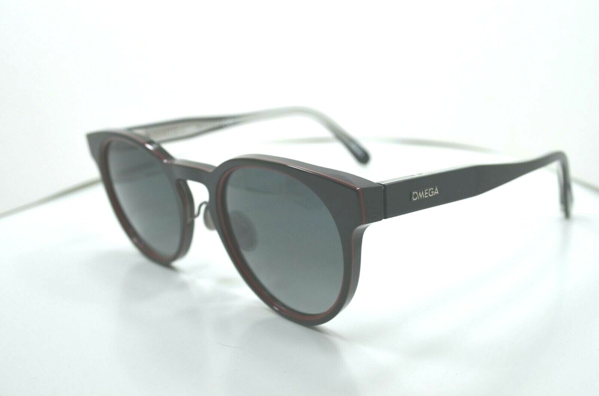 Omega Sunglasses OM 0020-H 01D Black Red Round Frames with Blue Lenses 24_STUDIO_NILS_LOLA2.  main image 2