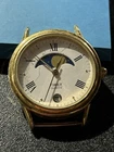 vintage Timex 364 T Cell gold-tone quartz watch featuring a sun and moon phase