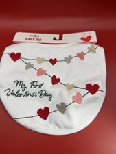 My First Valentine's Day" baby bib with embroidered hearts.