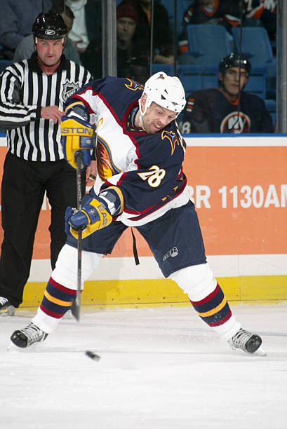 Left defenseman Niclas Havelid Atlanta Thrashers passes the - Ice Hockey Photo