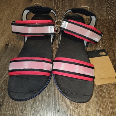 The North Face Skeena Sport Sandals in a red and black colorway featuring...