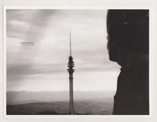 Silhouetted in Thought Lone Gaze Toward the Tower Unusual Abstract Surreal Photo