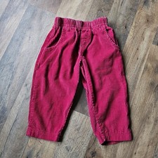 Vintage 80's and 90's OshKosh corduroy red pants with leather label on the back.