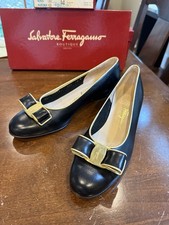 Salvatore Ferragamo Vintage Black and Gold Flats with Signature Bow