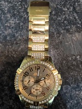 men watch gold tone Guess watch. gold plated strap