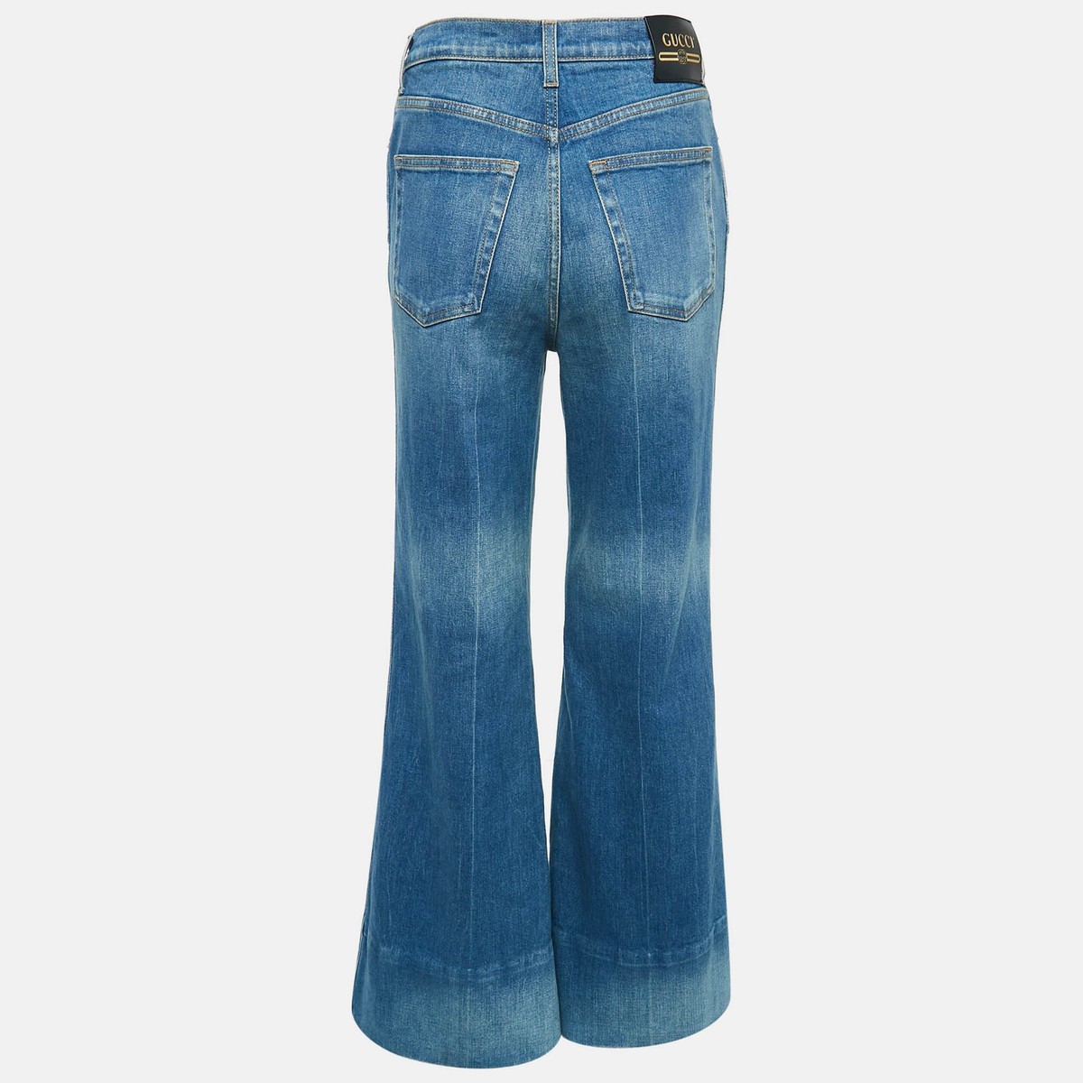 デニム・ジーパン GUCCI WIDE LIGHT BLUE JEANS WITH FADED EFFECT Gucci Blue Washed Denim Logo Patch Flared Jeans S Waist 26