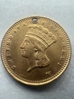 Photo of a 1861-P Gold Dollar from an eBay listing that sold on May 4, 2026