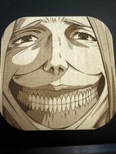 Smiling Titan Laser Engraved Basswood 2x2" - Attack on Titan Dina Fritz Fan Art