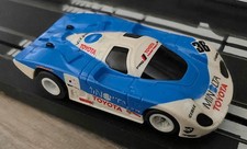 Tomy (Aurora) AFX Toyota 88CV Minolta #36, RT Chassis, Average but Working Cond.