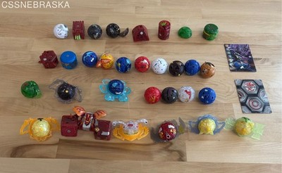 Collection of Bakugan toys and 2 cards