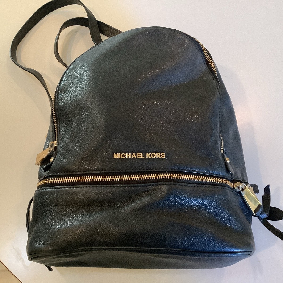 Michael Kors medium Reah backpack, black with gold hardware. Michael Kors Rhea Zip Pebbled Medium Slim Backpack Black  main image 3