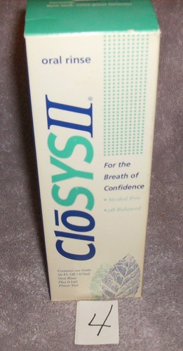 White CLYSOS 2 ORAL RINSE box with blue vertical text, green leaf accents, and “Alcohol Free” badge.