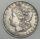 1886-O MORGAN SILVER DOLLAR, AU + Toned