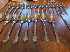 24 piece rogers stainless Korea 23 spoons and one knife