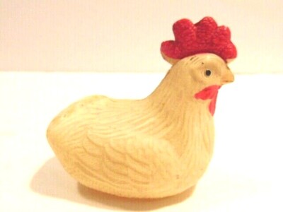 vintage small celluloid nesting chicken (missing tail feathers)