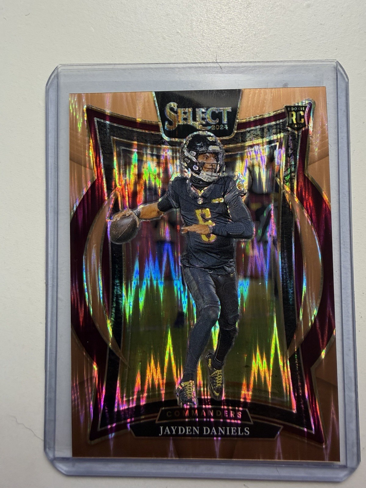 2024 Panini Select - Concourse Jayden Daniels #26 Copper Shock Prizm /299 (RC)