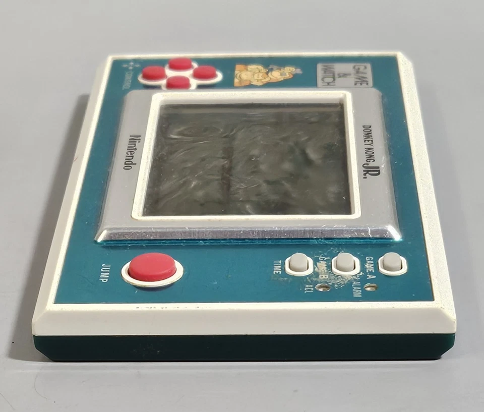 Juego y reloj Nintendo Donkey Kong Jr. 1982 vintage probado portátil RARO Foto 4 de 4