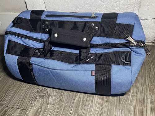 Blue and black Club Glove golf bag with dual handles, black straps, and visible white stitching on a wooden floor.