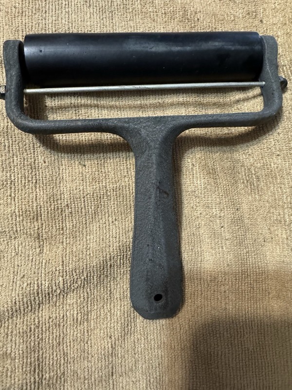 6 Inch Hard Rubber Roller Marked with Metal Handle Marked with 9 and 3.