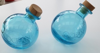 Two Full Size Ocean Organic Vodka Turquoise Blue Bottles EMPTY w/ Stoppers