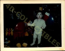 Vintage Candid Snapshot Photograph  Child's Playful Discovery on Christmas