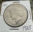 1925 Morgan 90% Silver Dollar. About Uncirculated.